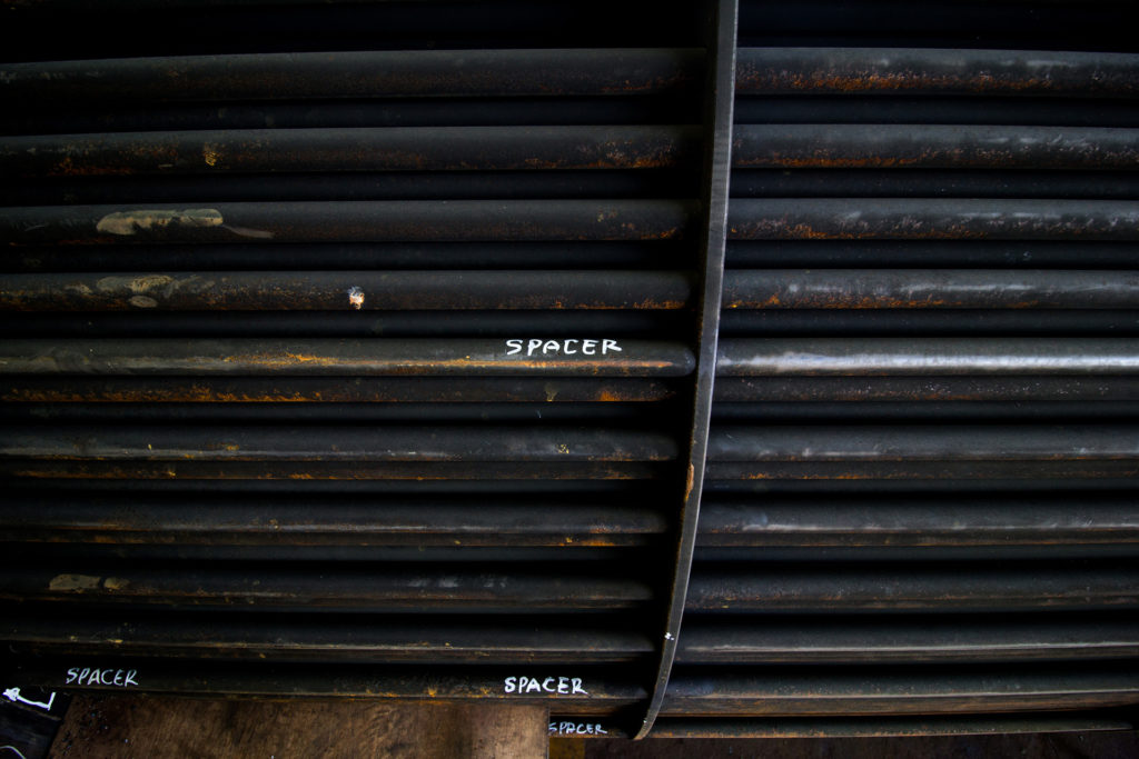 Rust steel tubes of the heat exchanger for maintenance, the water heater in the boiler as background